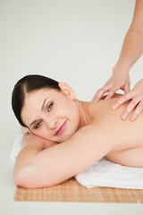 Obraz na płótnie Canvas Cute brunette enjoying a massage