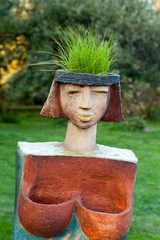 the flower pot in the form of the feminine head