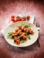 skewer with sausage and cherry tomatoes