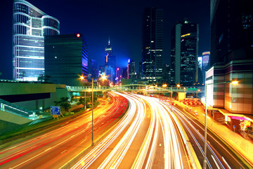 Fototapeta na wymiar Colorful city night with lights of cars motion blurred in hong k