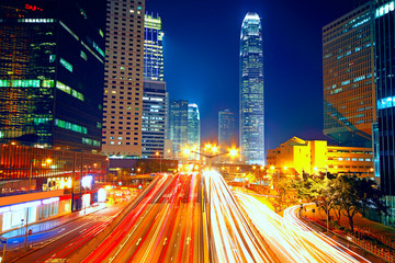 Colorful city night with lights of cars motion blurred in hong k