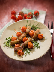 skewer with sausage and cherry tomatoes, selective focus