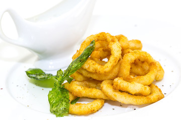 fried calamari rings on a white background
