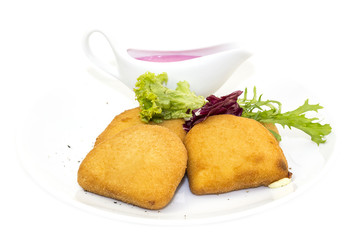 grilled cheese with sauce on a white background