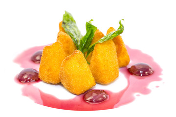 grilled cheese with berry sauce on a white background