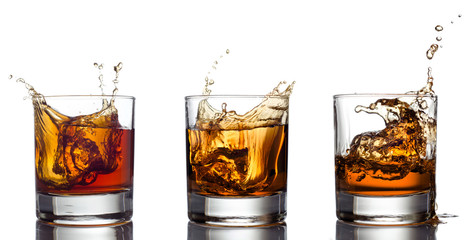 Glass of whiskey solated on white background