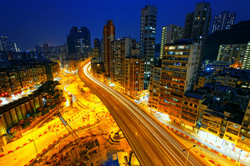 Fototapeta na wymiar Colorful city night with lights of cars motion blurred in hong k