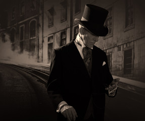 Man 1900 style wearing black hat and coat. Medicine man in Dicke - obrazy, fototapety, plakaty
