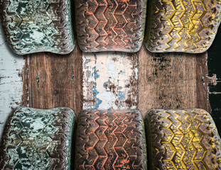 used tyres on wooden board background