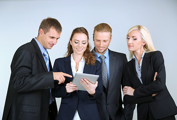 Group of business people on gray background