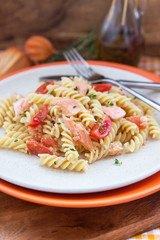 Fusilli pasta with smoked salmon and tomatoes