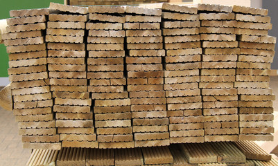 A Neat Stack of Machined Wooden Planks for Decking.