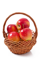 apples in a basket on white background