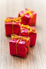 Decorative gifts on wooden background