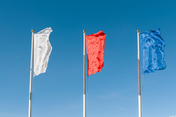 flags are developing in the wind