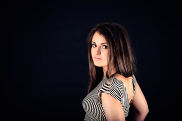 Fototapeta premium portrait of young nice sensual girl in black