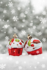 two toy cakes on snow decoration