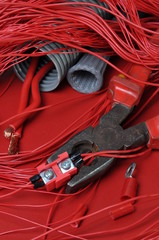 Electrical components and tools in the current colors of red-hot