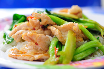 Kale vegetable with porky on rice.