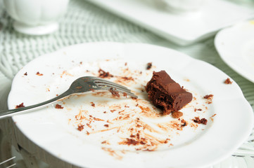 Soiled cake plates on rattan table