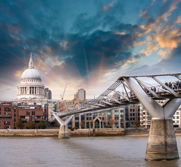 London, UK. Wonderful side view of Millennium Bridge at sunset,