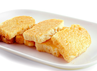 Garlic bread on white plate