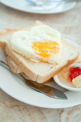 Breakfast - toasts, egg and strawberry jam