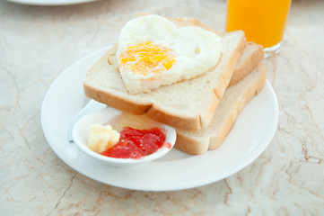 Breakfast - toasts, egg and strawberry jam