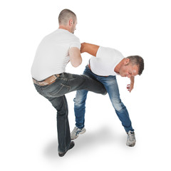 Man defending an attack from another man, selfdefense - obrazy, fototapety, plakaty