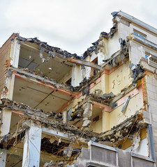 Demolishing of old house in city