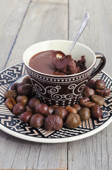 Peeled roasted chestnuts and chocolate cream ganache
