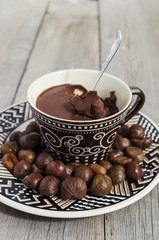 Peeled roasted chestnuts and chocolate cream ganache