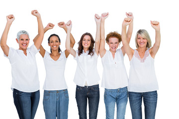 Obraz premium Smiling casual models posing with hands up