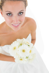 Obraz na płótnie Canvas High angle view of cute bride holding a bouquet