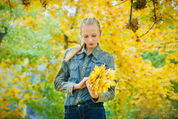 Young woman with autumn leaves