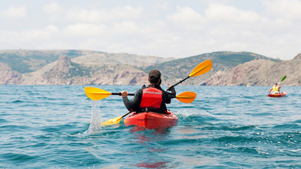 Young couple in a sea kayak.