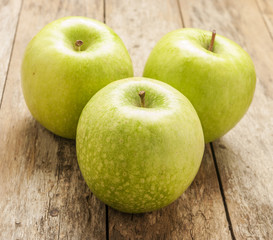 green apple on wooden background