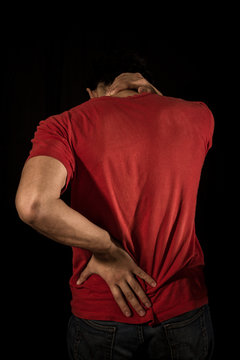Young man with neck and back pain