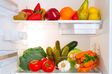 Fridge full of healthy fruits and vegetables
