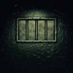 Prison cell door,barred window ,dramatic lighting