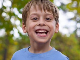portrait of a happy boy in the park © Vesna Cvorovic