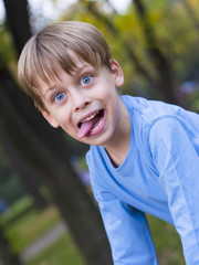 portrait of a happy boy in the park