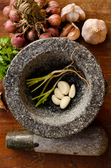Stone mortar with many kind of herbs