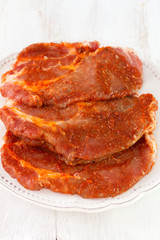 fresh meat with spices on plate