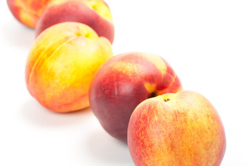 Ripe peaches fruits isolated on white