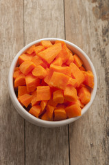 cut carrot on wooden background