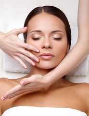 Face Massage. Close-up of a Young Woman Getting Spa Treatment.