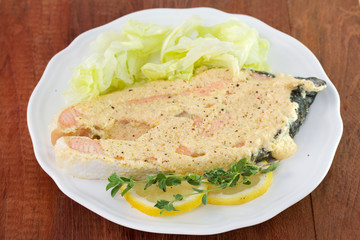 salmon with sauce and lettuce