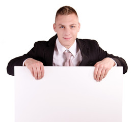 Businessman holding blank poster