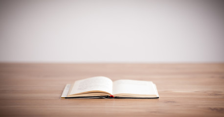 Open book on wooden deck